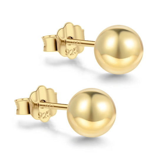 Tiny gold bead studs.